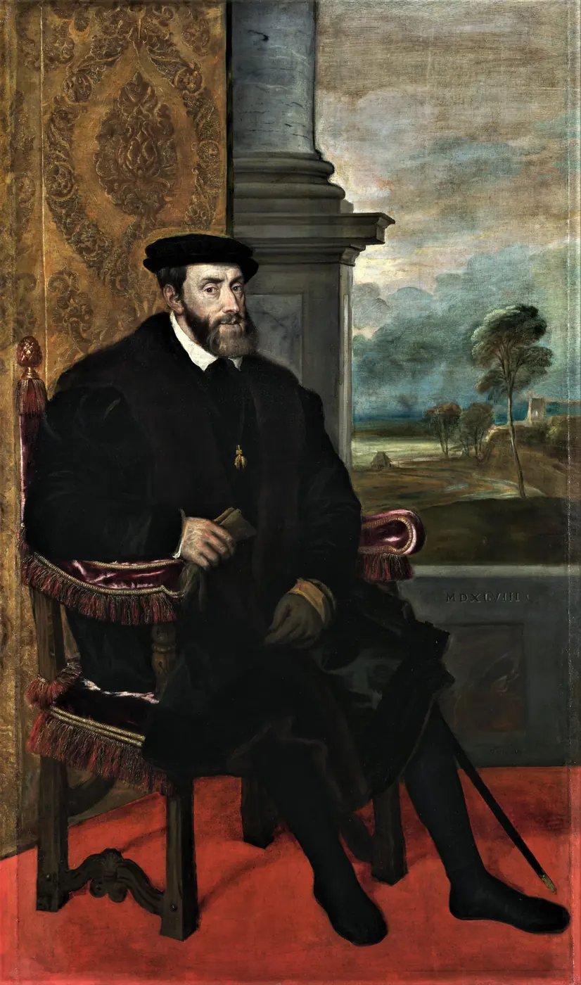 Geschilderd portret van keizer Karel V, zittend in een stoel, in het zwart gekleed met een zwarte hoed.